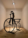 “Big-Wheeled Bike Rider Planter” by Tichoana Chinyanga