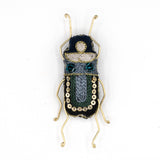 Kioni White-Spotted Beetle Beaded Brooch